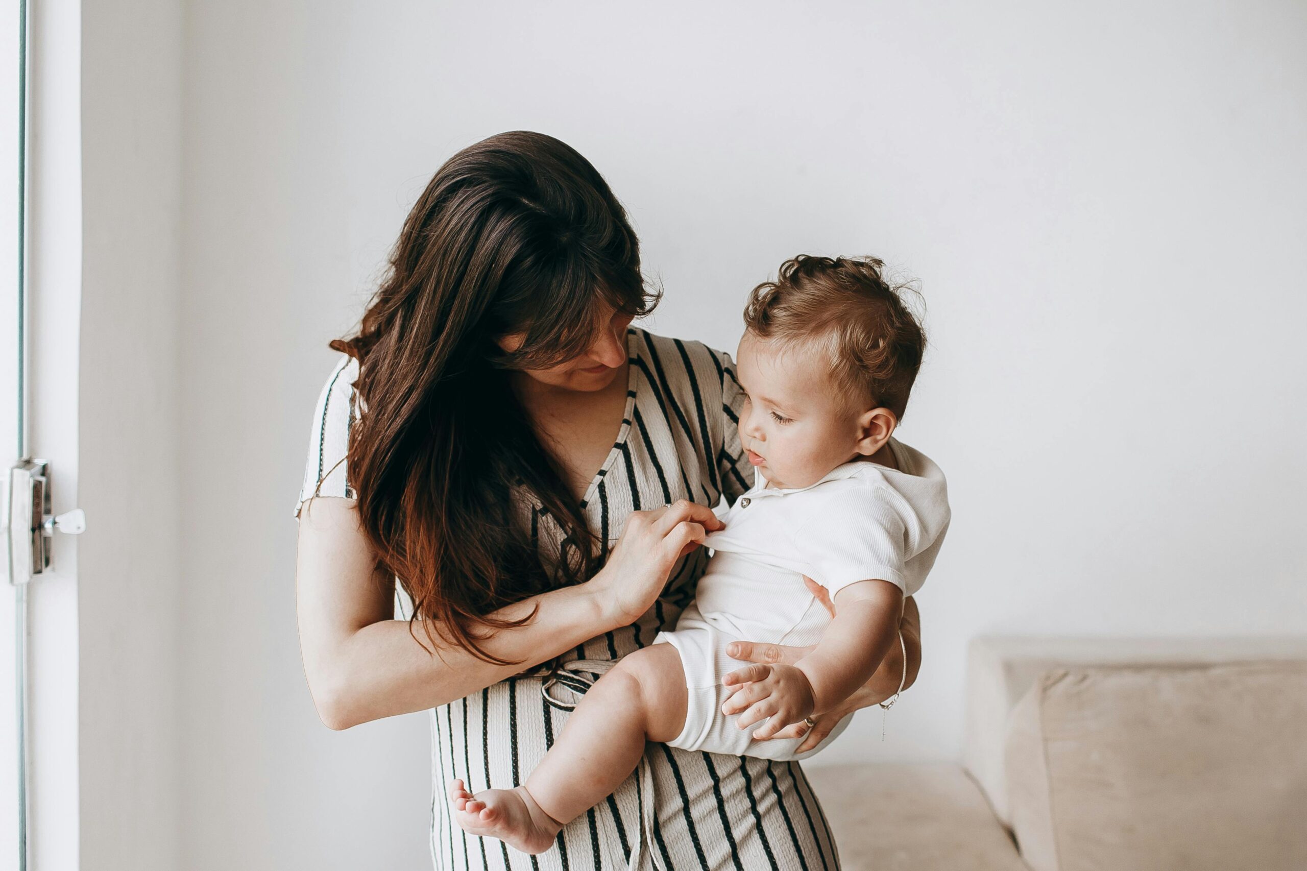 mother holding baby son